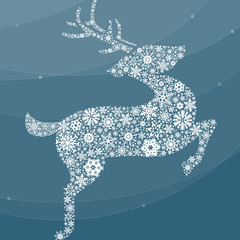 Reindeer made of snowflakes flying winter night