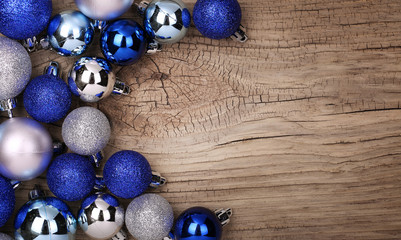 Blue Christmas Balls Over Wooden Background.