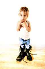 Little boy in military boots - 73698182