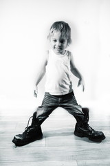 Little boy in military boots - 73698184