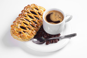 Plate with bun and cup of coffee