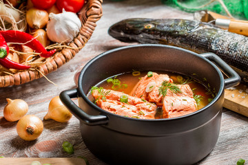 Spicy fish soup made ​​of salmon and spiced with dill
