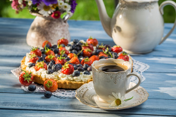 Coffee and fruit tarts served in the garden