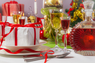 Candlelight and gifts all around the Christmas table