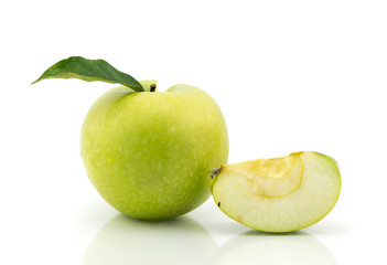 Green apples and half of apple on a white background