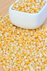 corn seeds in white bowl on table  for food concept