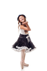 Naklejka premium Cute young ballerina sends air kiss to camera