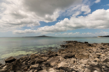 long white clouds above Rangitoto Island