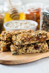Healthy homemade granola bars and   ingredients  on  background