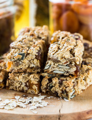 Healthy homemade granola bars and   ingredients  on  background