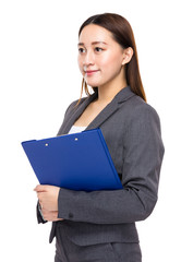 Businesswoman with clipboard and look away