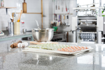 Uncooked Ravioli Pasta At Countertop In Commercial Kitchen
