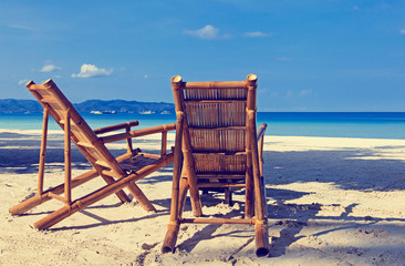 Two chairs on sand beach in Boracay, Philippines