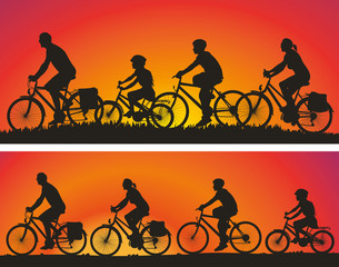 cyclists silhouettes on the background of sunsets