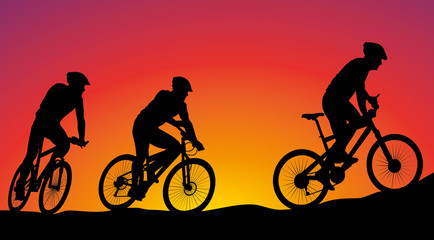 mountain bike race - vector silhouettes on the background