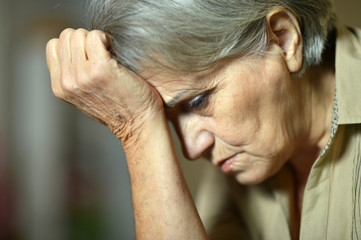 Fototapeta premium Sad aged woman