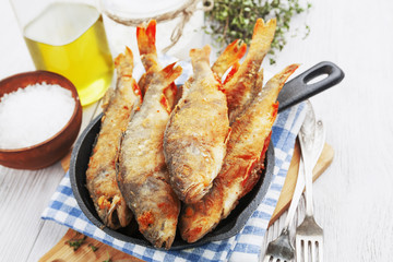Fried fish in a frying pan