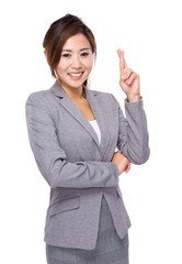 Businesswoman with finger cross