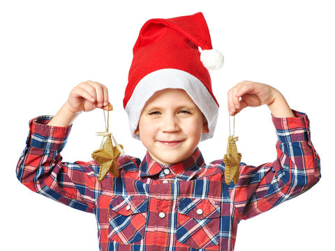 Little boy in red Santa hat with golden stars