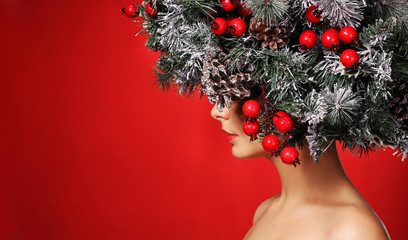 Christmas Woman. Fashion Girl with New Year Decorated Hairstyle.