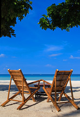 Two chairs on sand beach in Boracay, Philippines