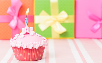 birthday cupcake with burning candle