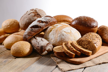 Fresh bread on table on white background
