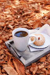 Cup of tasty hot drink and fresh cookies