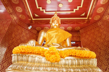 Thai Golden Buddha Statue in public shrine.