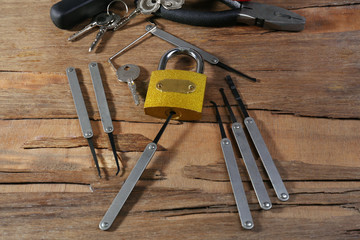 Tools of picking locks on wooden table