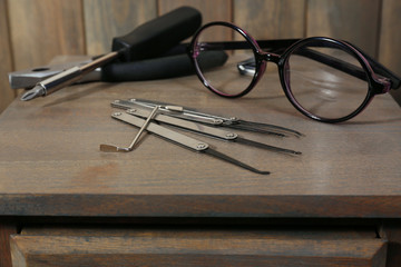 Lock picks on wooden table
