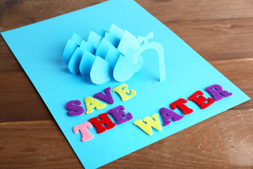 Concept of water conservation cut paper