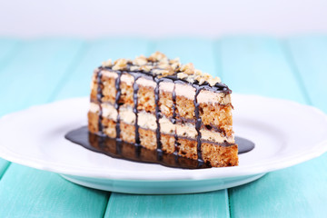 Delicious chocolate cake on plate on table close-up