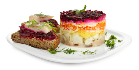 Russian herring salad  and sandwiches on plate isolated on