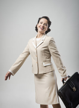 Cheerful Vintage Woman Walking With Briefcase