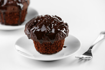 Yummy chocolate cupcake on table, close-up