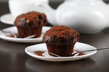 Yummy chocolate cupcake on table