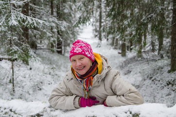 Portrait of a middle-aged woman in winter in the forest