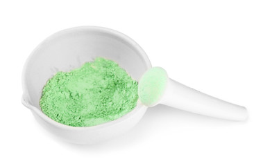 Laboratory pestle in mortar with ground material, isolated