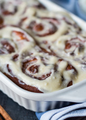 Cinnabon buns with cinnamon and nuts in baking dish