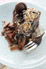 Yummy chocolate cake served on table