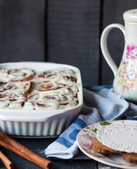 Cinnabon buns with cinnamon and nuts in baking dish