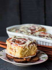 Cinnabon rolls with cinnamon and nuts on a plate