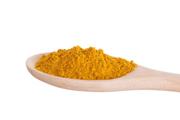 Curry seasoning in a wooden spoon, it is isolated
