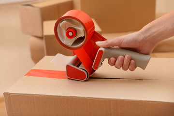 Packaging parcels with dispenser close-up