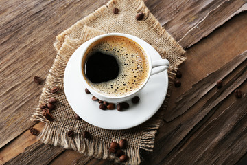 Cup of coffee on wooden table