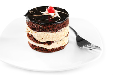 Yummy chocolate cupcake on white plate, close-up