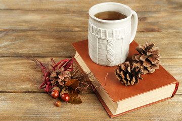 Cup of tea with book on table close-up