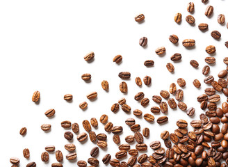 Coffee beans on white table, close-up