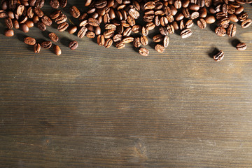 Coffee beans on wooden background
